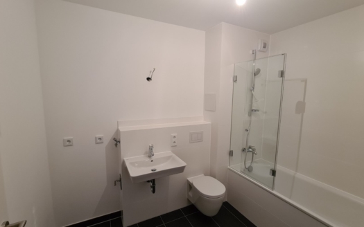 *ERSTBEZUG* Modernes 1-Zimmer-Apartment mit kleinem Gartenanteil und exklusivem Dachgarten